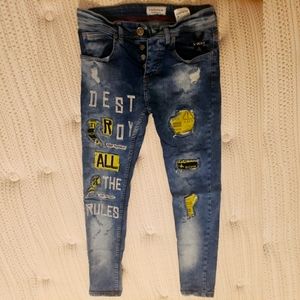 NEW Light wash denim jeans with patches.